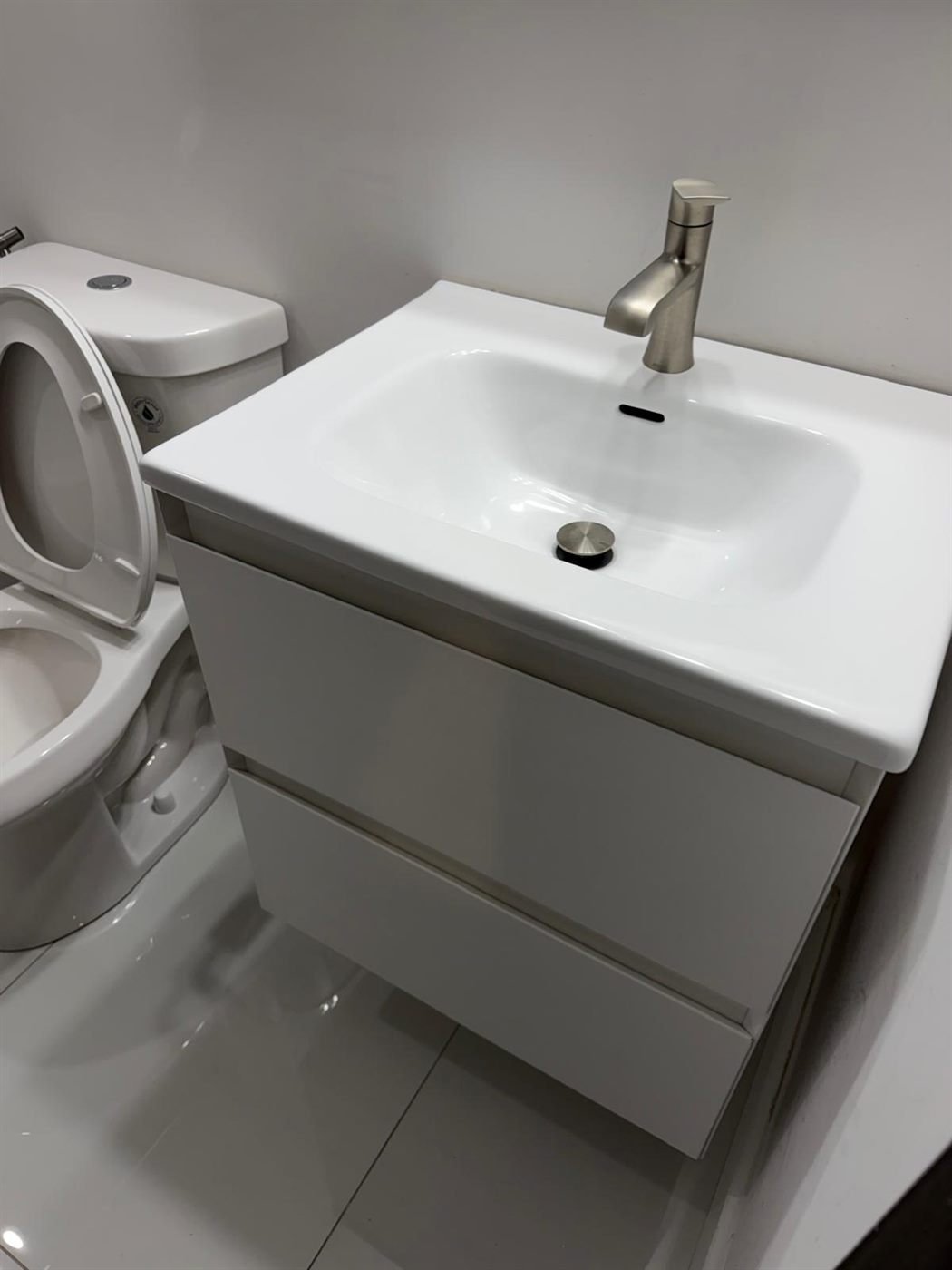 Sparkling clean white bathroom vanity and sink after a turnover cleaning in Greater Boston