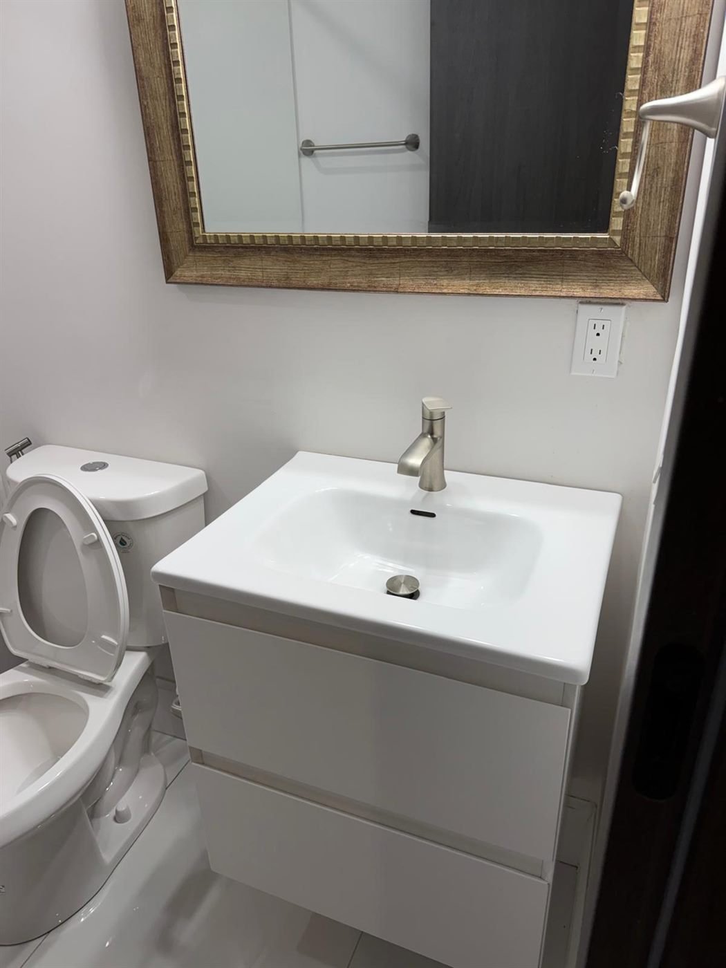 Clean bathroom vanity and toilet after a move-out cleaning