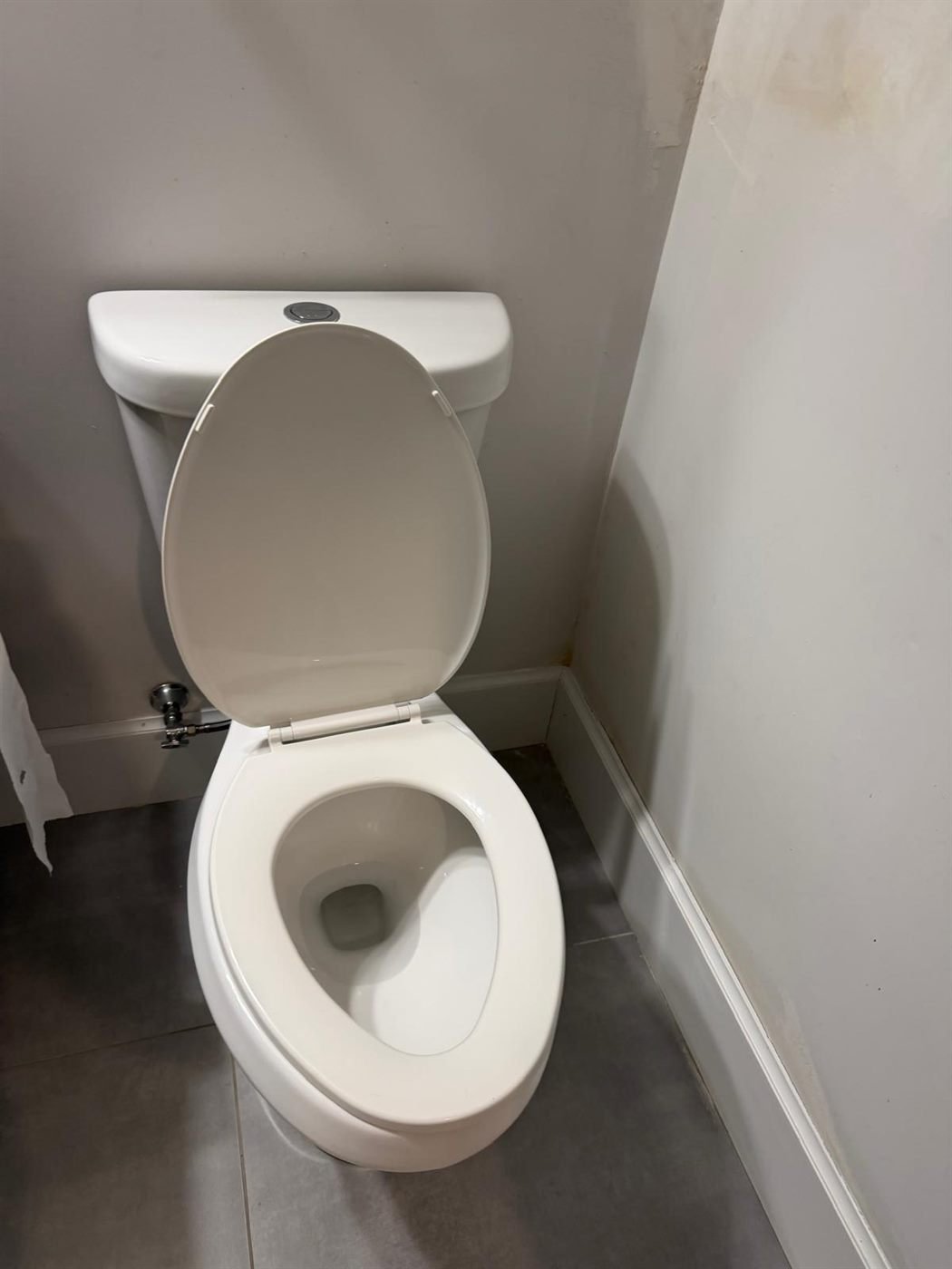 Spotless white toilet after a turnover cleaning in Greater Boston